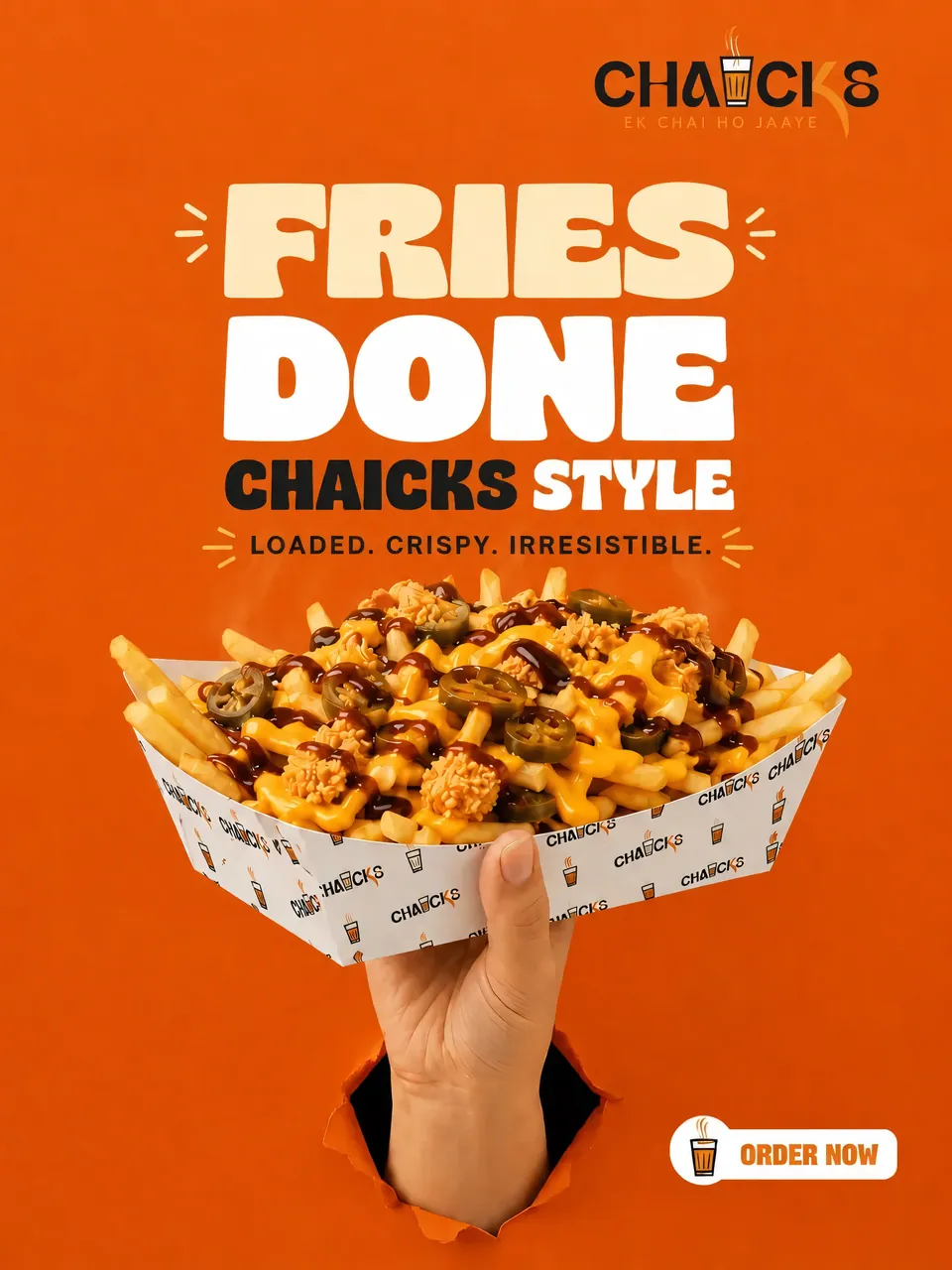 Fries done CHAICKS style — loaded fries held up through an orange paper wall