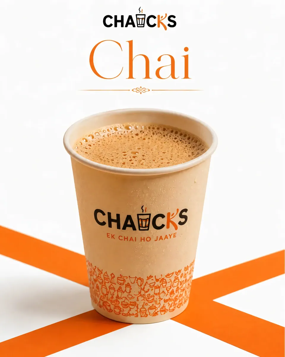 CHAICKS signature chai in a branded kraft cup on an orange X