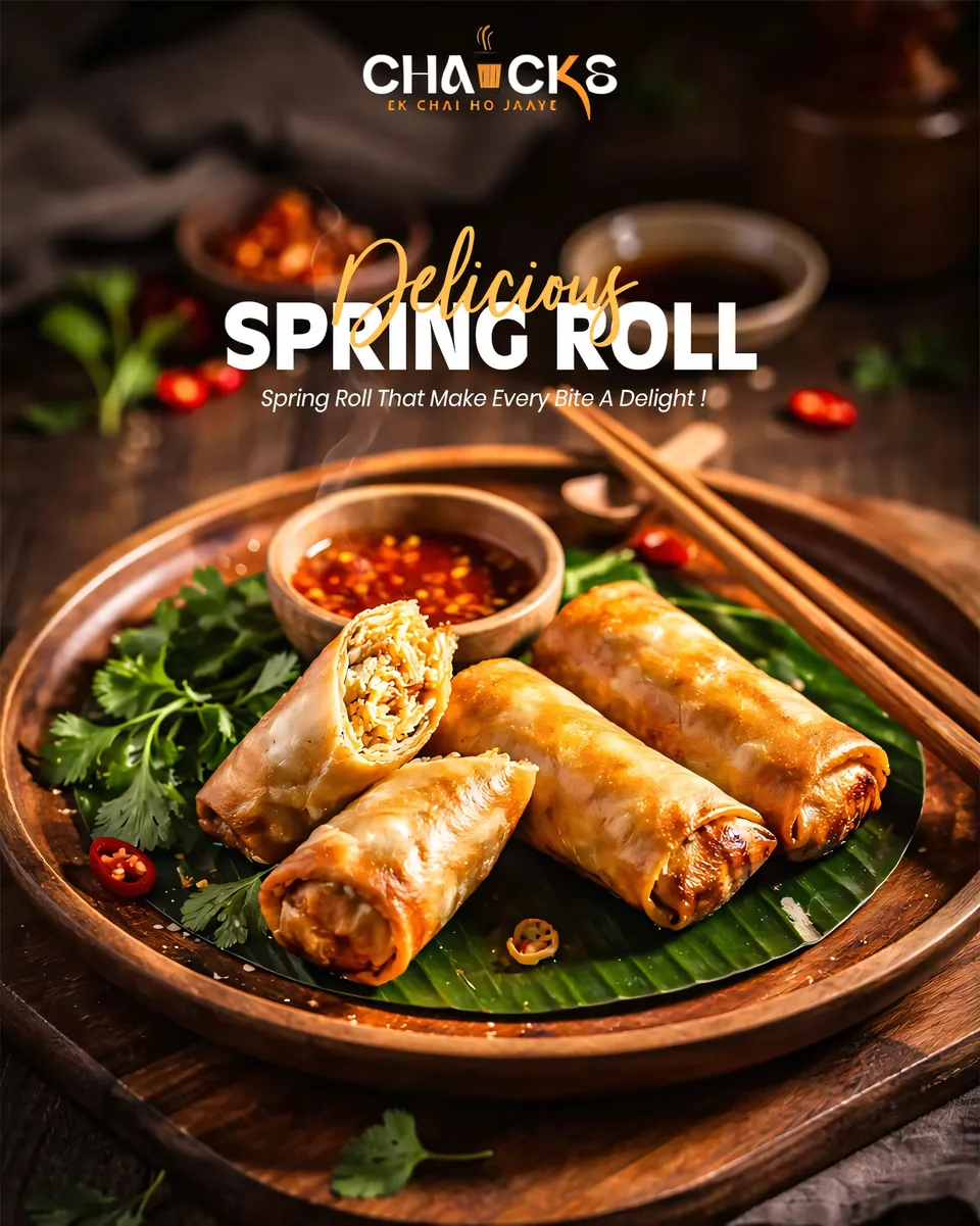 Delicious spring rolls on a banana leaf with chilli dip